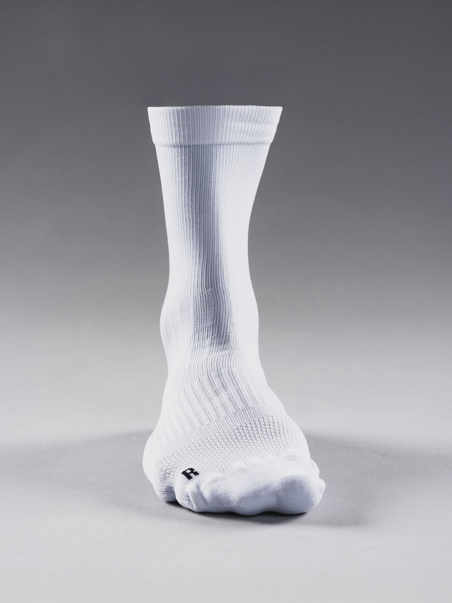 White Fusion run sock with left and right specific socks for better fit