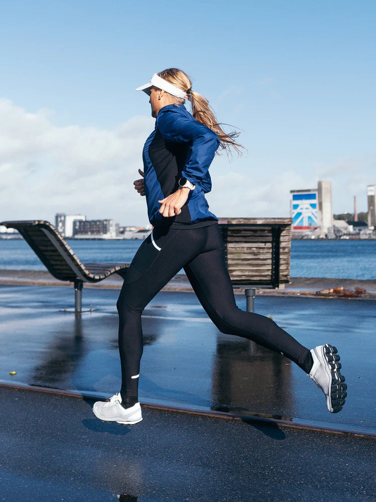 Fusion Women's S1 Run Jacket in Night blue on runner