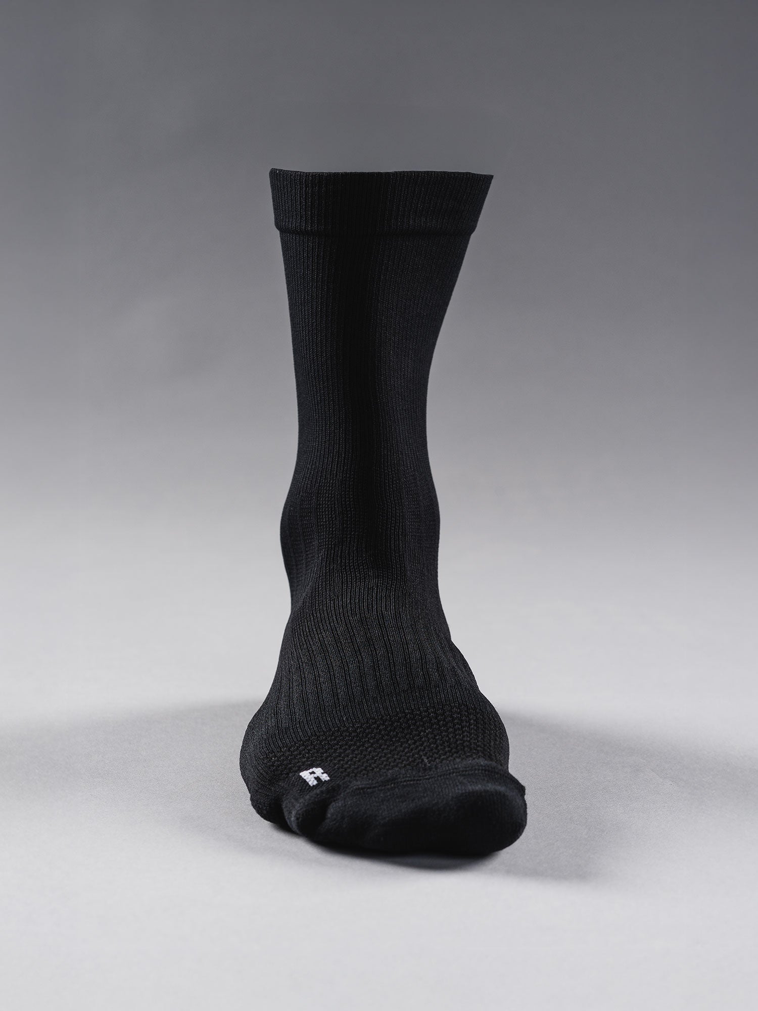 Mens running sock in black with onger length for extra angle support