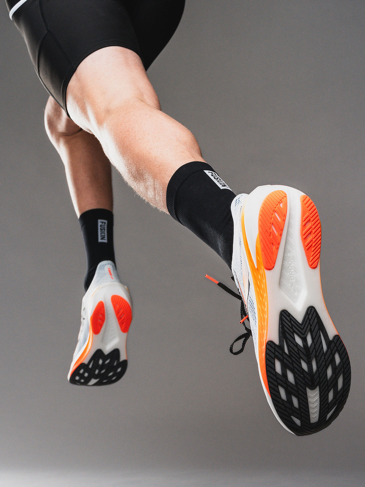 Fusion running sock in black with Fusion logo 