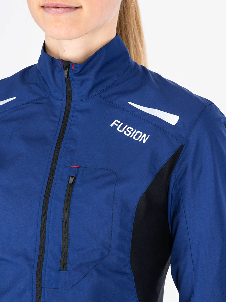 Fusion Women's S1 Run Jacket in Night blue  with reflective logo and strip for extra visibility in the dark